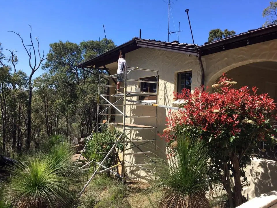 Two-storey house in the hills under scaffold